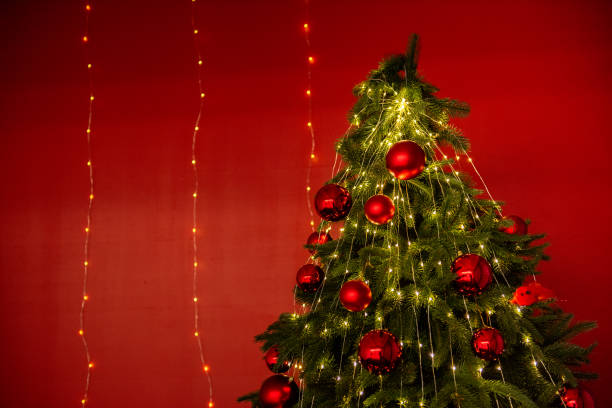 istock Background Christmas tree with red ornaments and fairy lights 2170730840