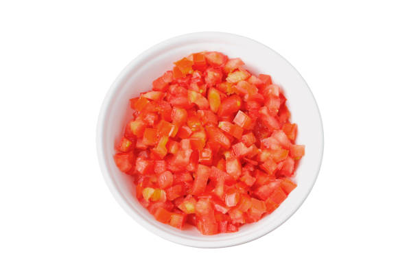 istock Raw chopped and diced tomatoes cubes in ceramic bowl isolated on white background 2170744909