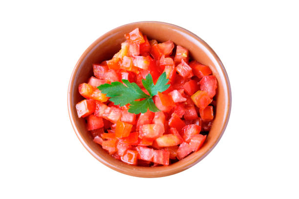istock Raw chopped and diced tomatoes cubes in ceramic bowl isolated on white background 2170744910