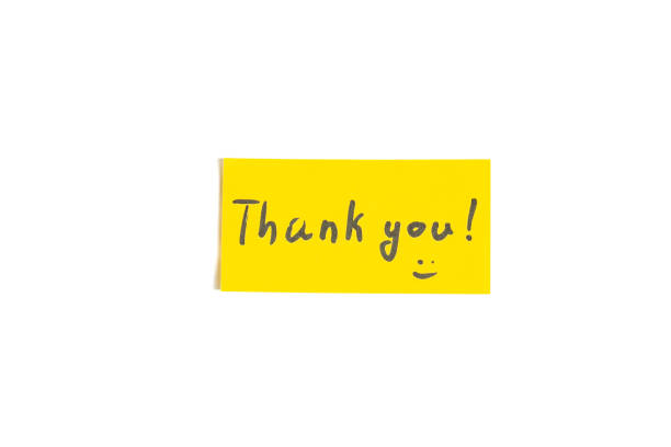 istock A small note with the word thank you on a white background 2170746381