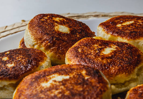 istock Fresh fried cottage cheese pancakes on a white plate close up 2170749671