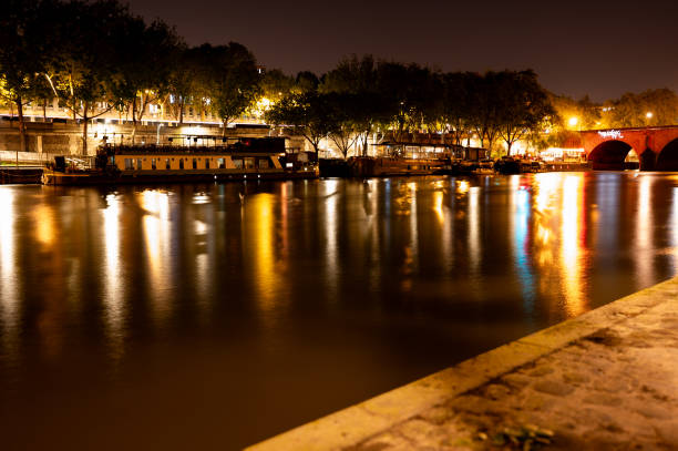 Reflections on the Seine at night, long exposure