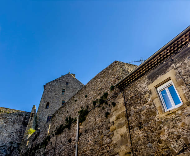 Photo of magnificent sunset over the ruins of castle of the Queen Jeanne near Eyguieres with dazzling sunbeams. This photograph was taken in the Alpilles in Provence in France.