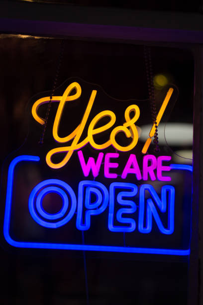 istock Vibrant Multi-Colored Neon Sign: Yes! We Are Open 2170760686