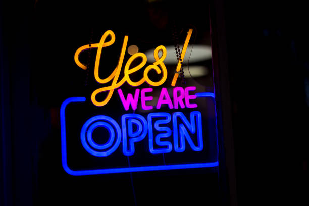 istock Vibrant Multi-Colored Neon Sign: Yes! We Are Open 2170760718