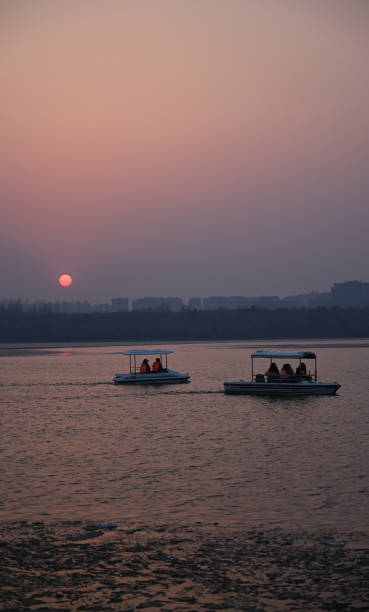 istock Boat at sunset in the park 2170764336