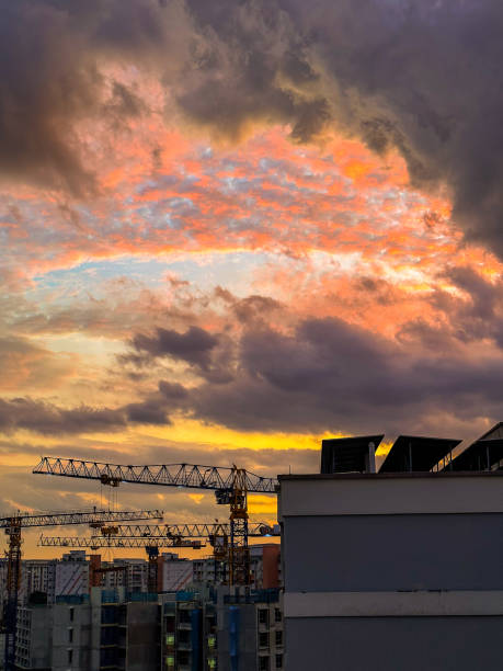 istock Singapore Public Housing Construction Site with Dramatic Sunset Sky and Cranes 2170766946