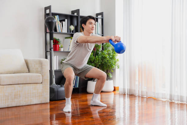 istock Asian man working out excerise at home. 2170768011