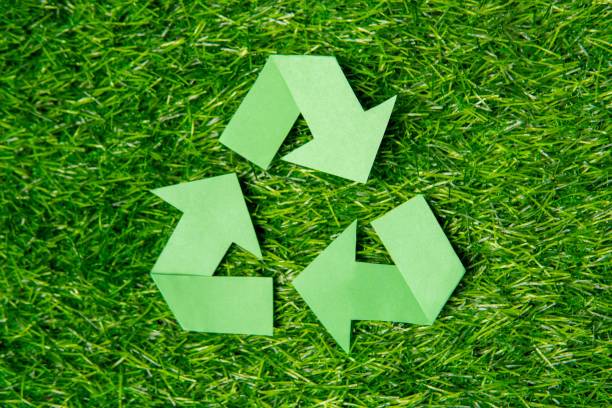 istock A green recycling symbol on a lush grass background with copy space. 2170770681
