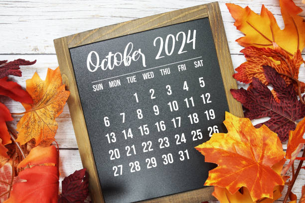 istock October 2024 monthly calendar maple leaf decoration on wooden background 2170771221
