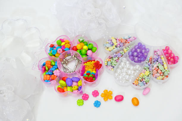 istock Set of multi-colored beads for needlework, child making jewelry at home. Easy and creative craft for children and teenagers. Making jewelry 2170771828