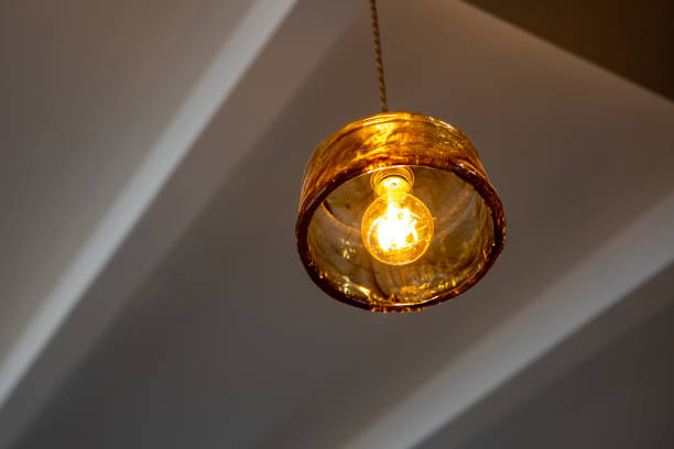 istock Hanging Edison light bulb, also known as filament light bulb. with glass shade 2170775404
