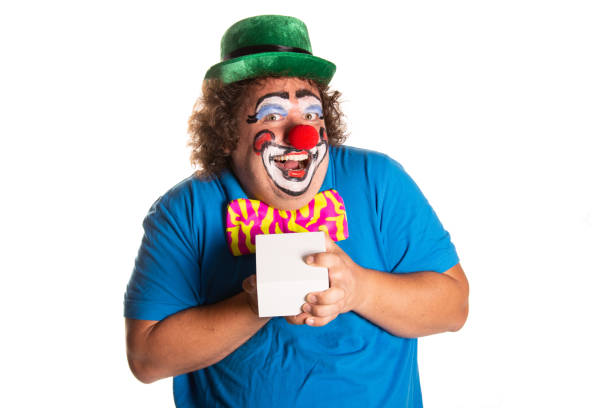 Clown holding cardboard with drawing