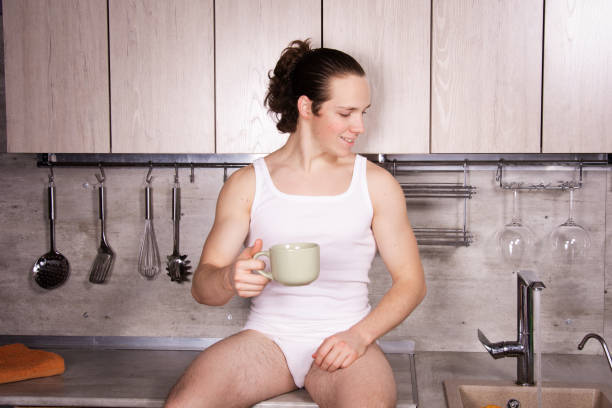 istock A young attractive man is preparing a delicious lunch in the kitchen. 2170776486