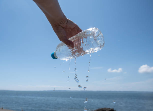 istock Person holding a cold drink 2170778940