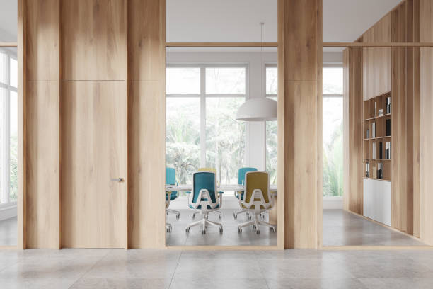 istock Modern office interior with wooden walls and empty chairs with large windows in the background, light concept. 3D Rendering 2170781276