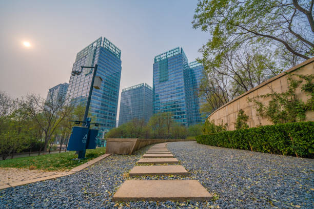 Beijing, China - November  23: Walking path with a view of city buildings in Central Park in the financial district on November 23, 2019 in Beijing