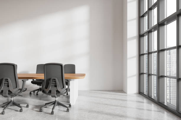 istock Stylish office room interior with meeting table and chairs, panoramic window 2170781776