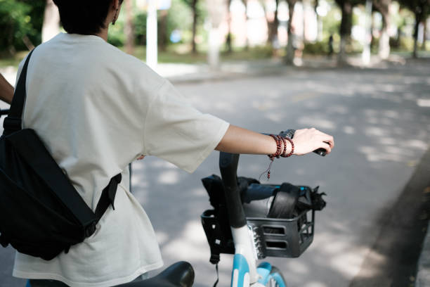 istock People getting ready to go on a bicycle 2170783763