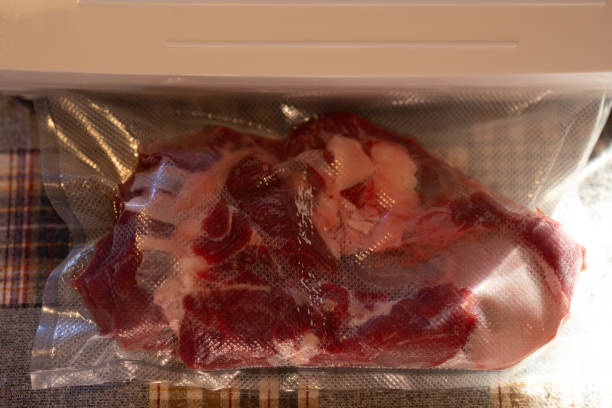 istock Big piece of fresh beef being vacuum sealed 2170783940