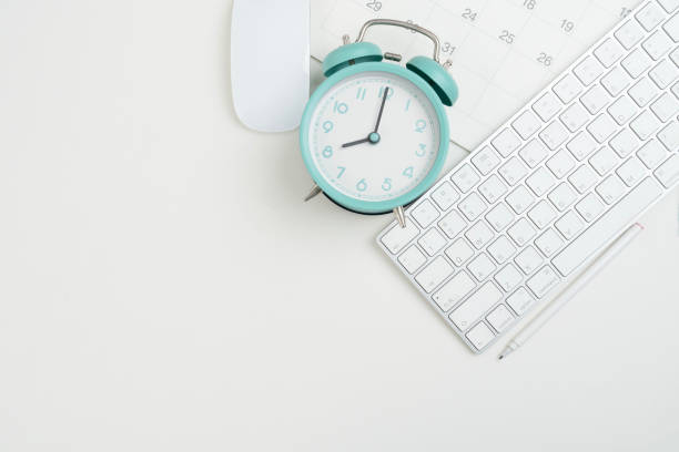 istock engineer or architect desk with stationery, calendar, alarm clock on orange color table background in the office, project ideas concept 2170785729