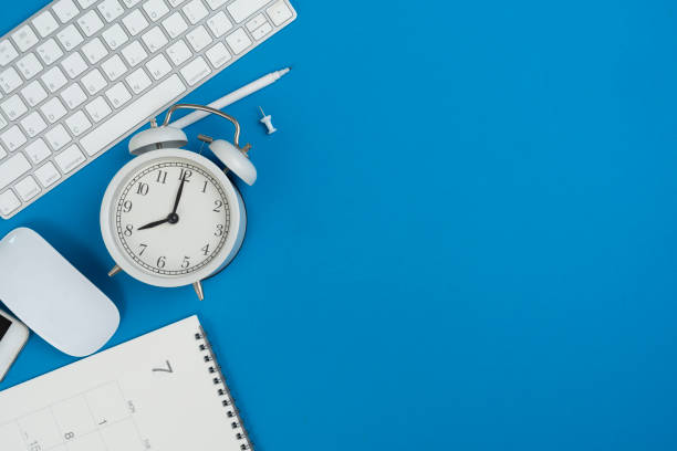 istock engineer or architect desk with stationery, calendar, alarm clock on blue color table background in the office, project ideas concept 2170785741