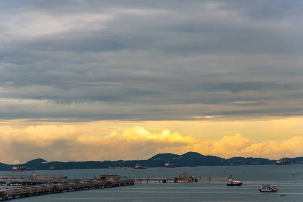 istock Logistic shipping quay boat in twilight sky night Engineering crane depot at logistic export terminal control. Warehouse freight background container yard loading quayside harbor port Logistics. 2170786546