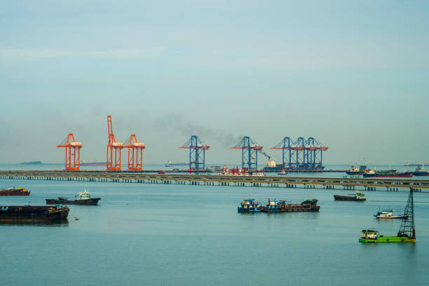 istock Logistic shipping quay boat Engineering crane depot at logistic export terminal control. Warehouse freight background container yard loading quayside harbor port. Logistics seascape shipping portal 2170786760