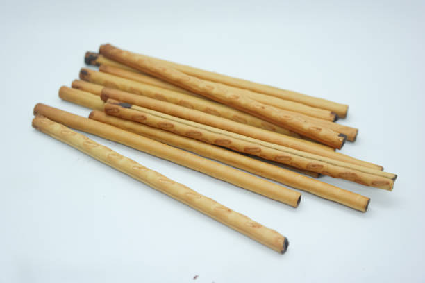 istock Close-up of several chocolate sticks arranged diagonally on a white background 2170789144