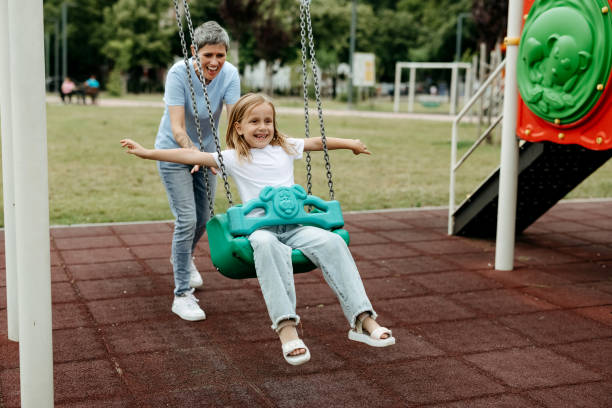 istock Little girl swinging in park 2170789632