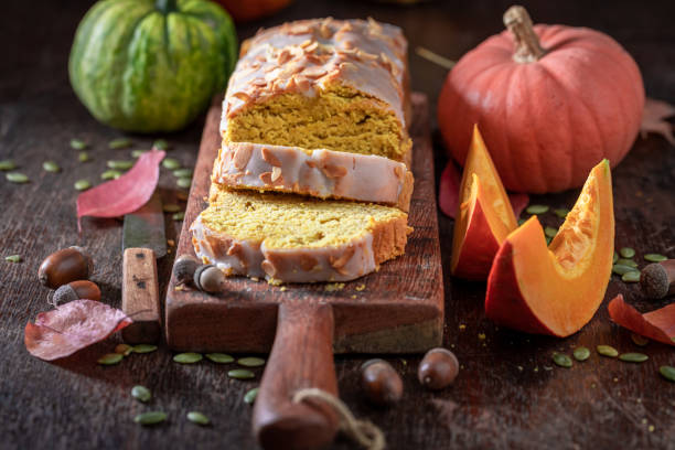 istock Aromatic pumpkin pound cake with white glaze and almonds. 2170789896
