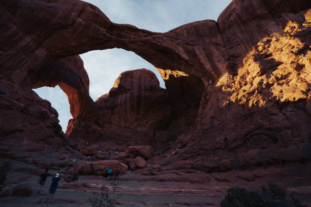 Moab, Utah, USA, July 5, 2024: Tourist visiting Double Arch in Arches National Park on July 5, 2024 in Moab, Utah, USA,