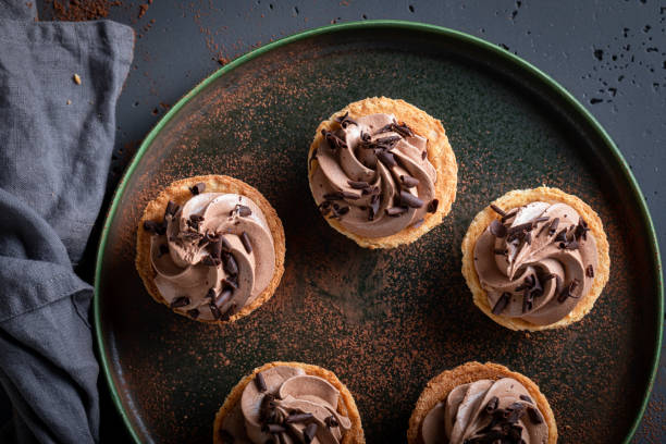 istock Delicious mini tartlets with sprinkles and chocolate cream. 2170790743