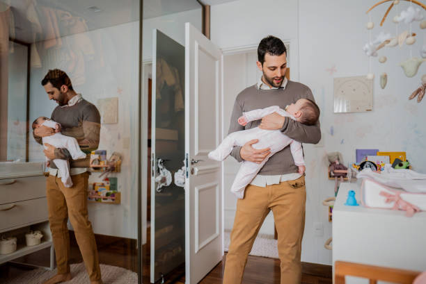 istock Father with daughter on his lap at home 2170796092