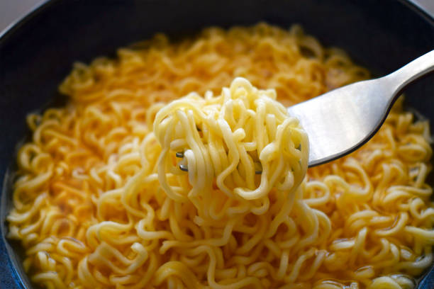 istock Instant noodles in a bowl with a fork. 2170799266