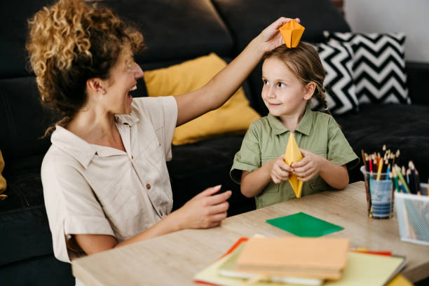 istock Mother helps her daughter with her homework 2170799618