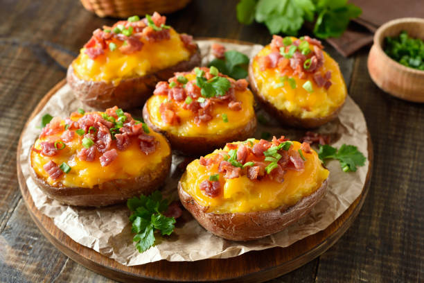 istock Baked stuffed potatoes with bacon, green onion and cheddar chees 2170801575