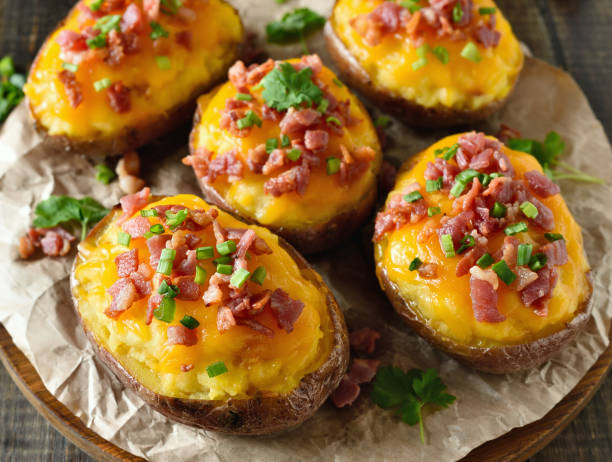 istock Baked stuffed potatoes with bacon, green onion and cheddar chees 2170801582