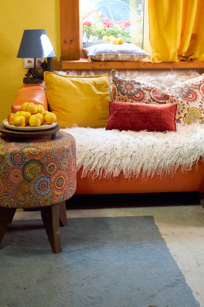istock design interior of a creative workshop in yellow and blue tones, with an orange sofa and colorful cushions 2170802591