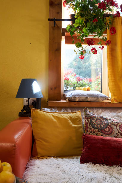 istock design interior of a creative workshop in yellow and blue tones, with an orange sofa and colorful cushions 2170802710