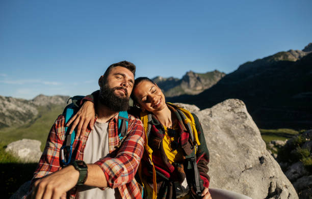 istock Smiling Couple Resting After Hiking in the Mountains 2170802926