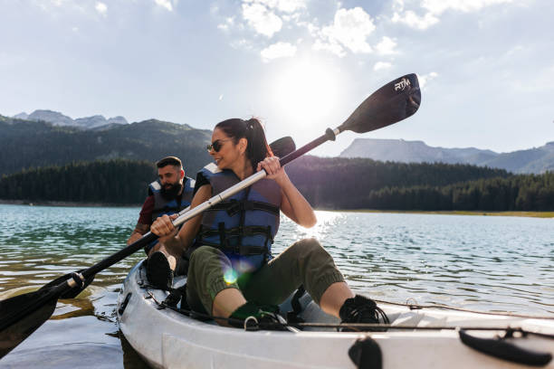 istock Couple Kayaking on a Scenic Mountain Lake 2170802928