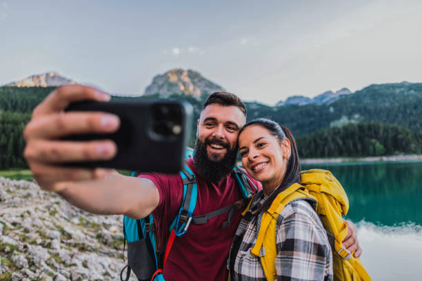 istock Smiling Couple Taking a Selfie During Mountain Hike 2170802946