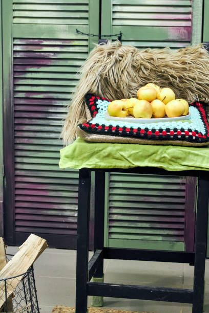 creative handmade bar stool with knitted textile decor stands in the interior of a creative workshop