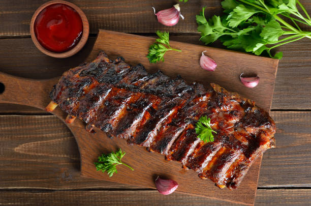 Grilled pork ribs on cutting board