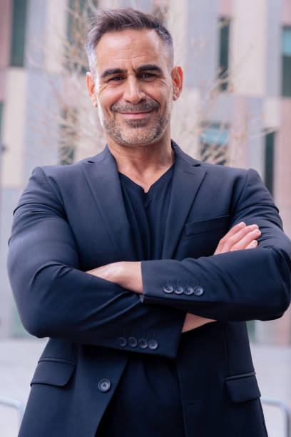 istock portrait of smiling businessman looking at camera outdoors.Vertical 2170804058