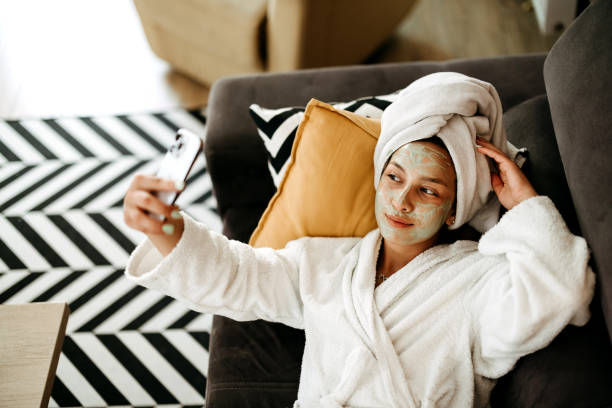 istock Woman takes a selfie on the bed 2170805041
