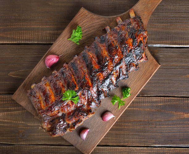 istock Grilled pork ribs on cutting board 2170805863