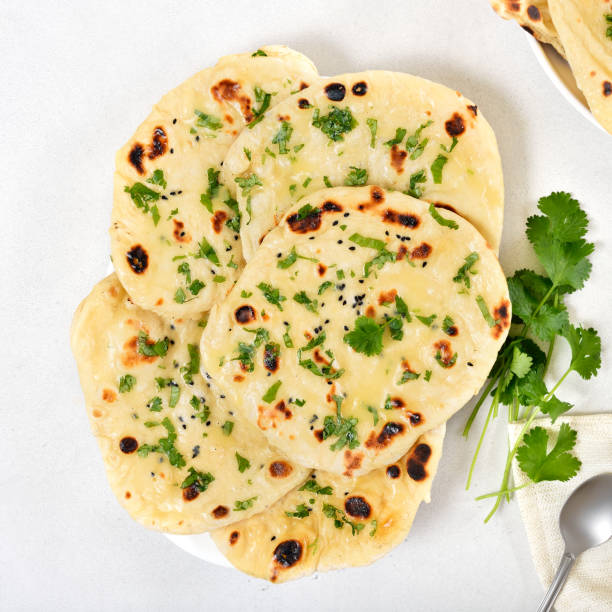 istock Homemade indian naan bread over light background 2170806265