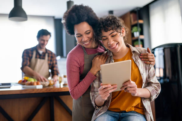 istock Happy multiethnic family using digital devices for online study. E-learning education people concept 2170806479